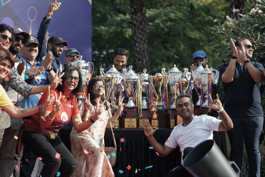 Employees celebrating with trophies at a corporate sports meet in Pune